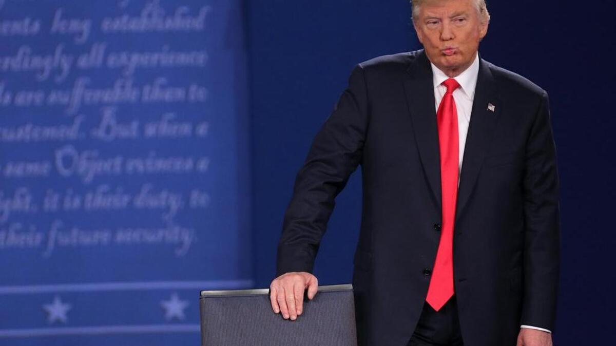 Donald Trump listens during his second presidential debate with Hillary Clinton Sunday in St. Louis.