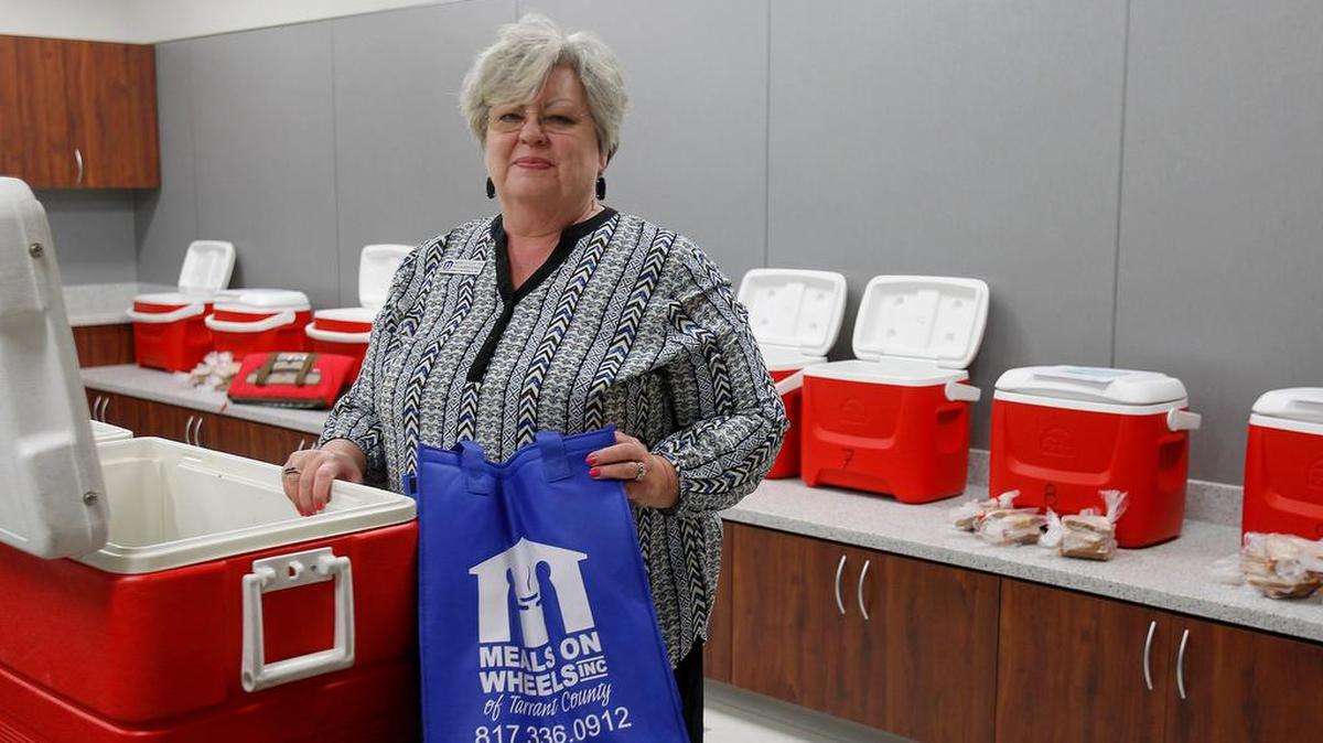 Meals on Wheels vice president of volunteer services Nedra Cutler shows facilities at the organization’s new Tarrant County office in Fort Worth on April 14.