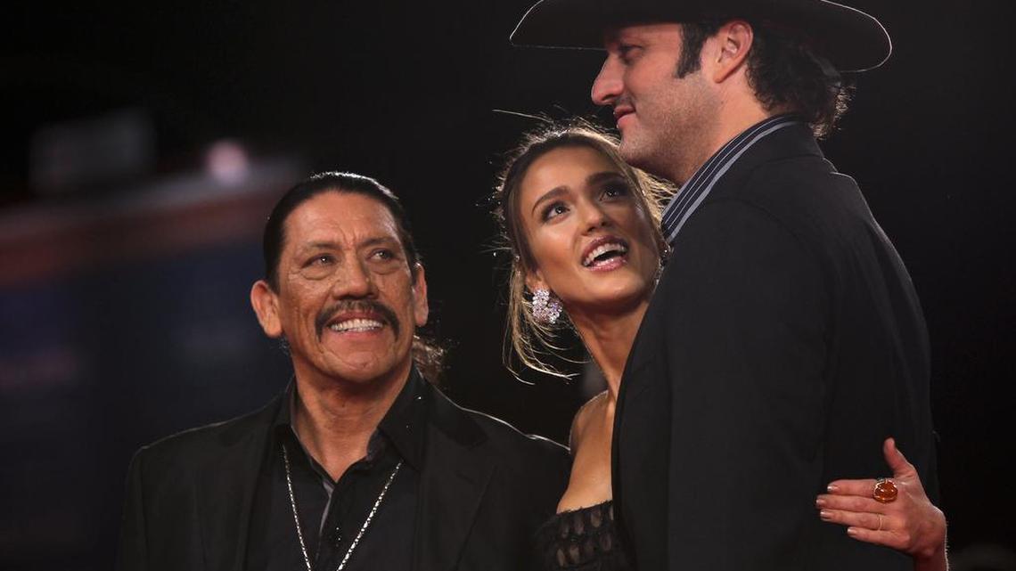 Director Robert Rodriguez, right, actress Jessica Alba, and actor Danny Trejo, left, arrive for the screening of the film Machete at the 67th edition of the Venice Film Festival in Venice, Italy, Thursday, Sept. 2, 2010.
