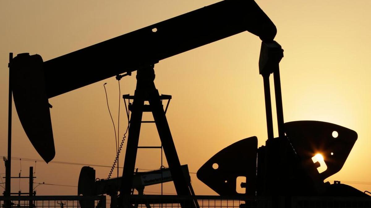FILE -- In this Sept. 30, 2015, file photo, oil pumps work in the desert oil fields of Sakhir, Bahrain. Global oil supply growth is plunging as drillers slash capital expenditures severely, Europe's energy policy group said Monday, Feb. 22, 2016, which could eventually result in an energy shock.