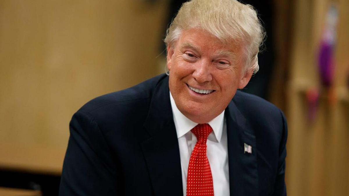 Republican presidential nominee Donald Trump smiles as he meets with students and educators Thursday in Cleveland.
