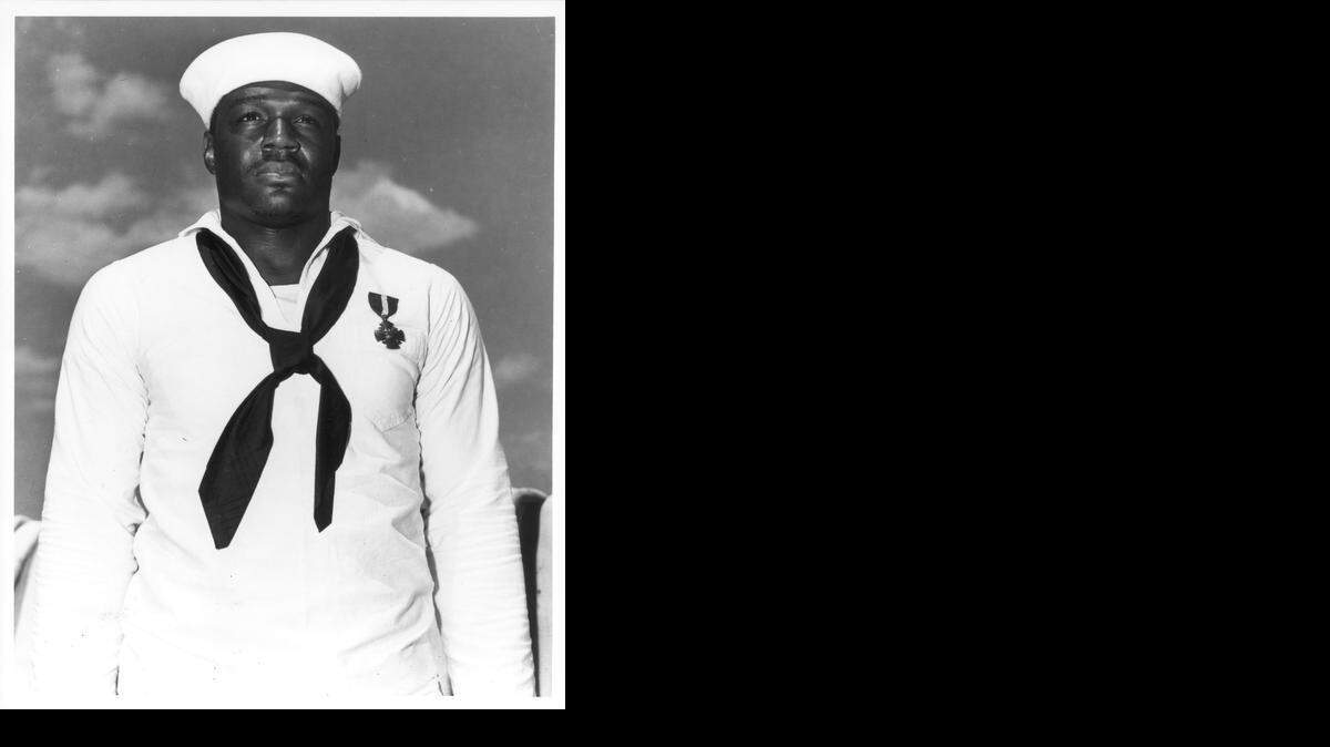 
SC2 Doris (Dorie) Miller, USN, after receiving The Navy Cross at Pearl Harbor for heroism on the USS West Virginia, March, 1942 
