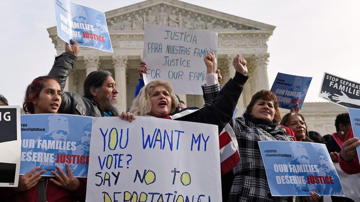 Demonstrators participate in an immigration rally outside the Supreme Court in Washington.