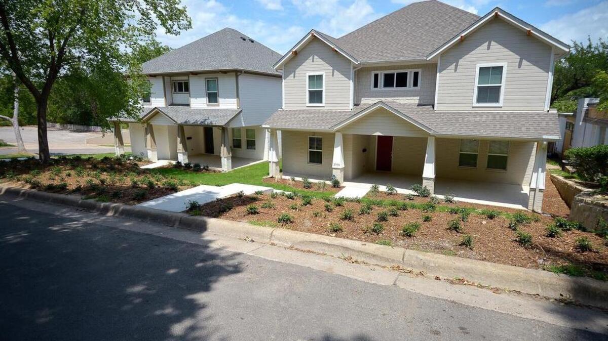
Two houses on Sandage Avenue where developers tore down historic homes and built large, 5-bedroom houses to meet the need for student housing. 
