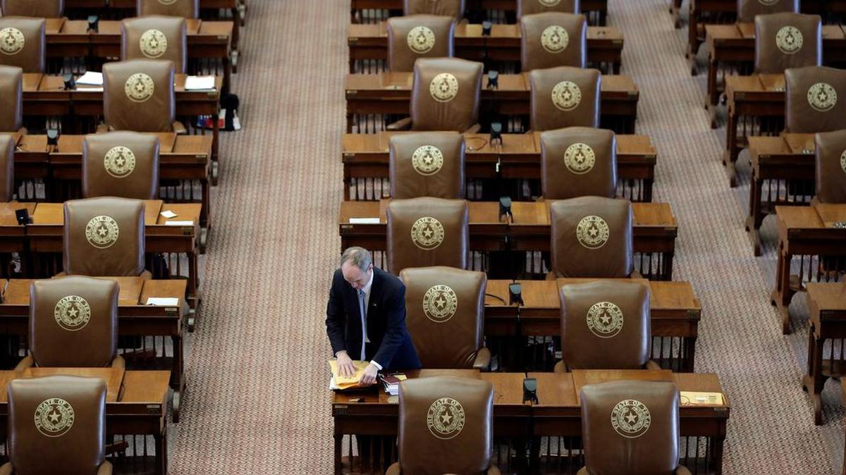 Rep. Mike Schoefield, R-Katy, packs up his desk on the final day of the legislative session in 2015.