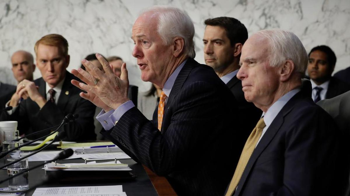 Republican members of the Senate Select Committee on Intelligence, from left, Sen. James Lankford, R-Okla., Sen. John Cornyn, R-Texas, Sen. Tom Cotton, R-Ark., and Sen. John McCain, R-Ariz., question former FBI director James Comey as he recounts a series of conversations with President Donald Trump this week.