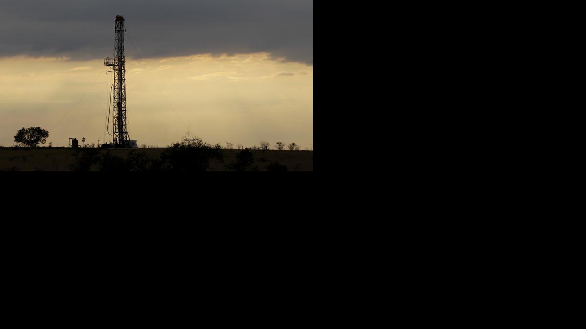 
A drilling rig is seen near Kennedy, Texas
