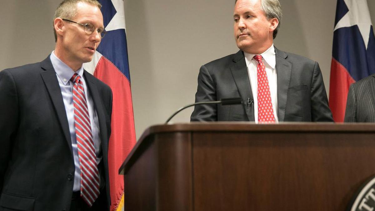 Harrold ISD Superintendent David Thweatt, left, and Texas Attorney General Ken Paxton speak Wednesday during a news conference announcing Paxton’s lawsuit challenging a federal transgender bathroom order.