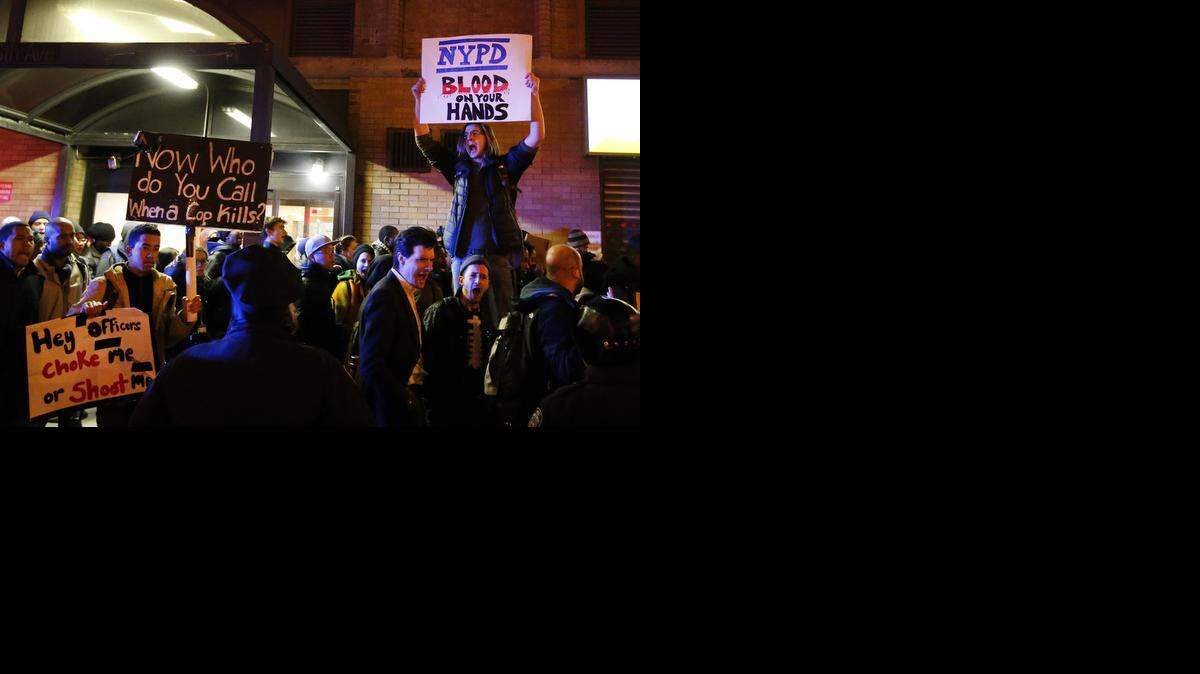 
Protesters rally against a grand jury’s decision in the death of Eric Garner in the early morning hours Friday in New York. 
