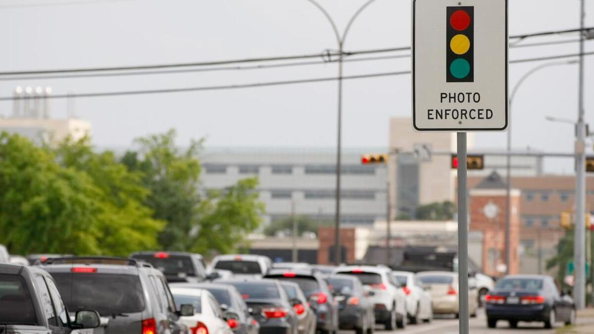 Arlington banned red-light cameras like those at the intersection of Division Street and Cooper Street after a 2015 election. (Star-Telegram/Khampha Bouaphanh)