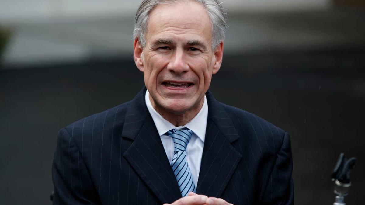 Texas Gov. Greg Abbott talks to reporters outside the White House in Washington.