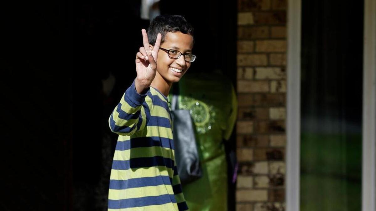 
Ahmed Mohamed, 14, gestures as he arrives home in Irving. 
