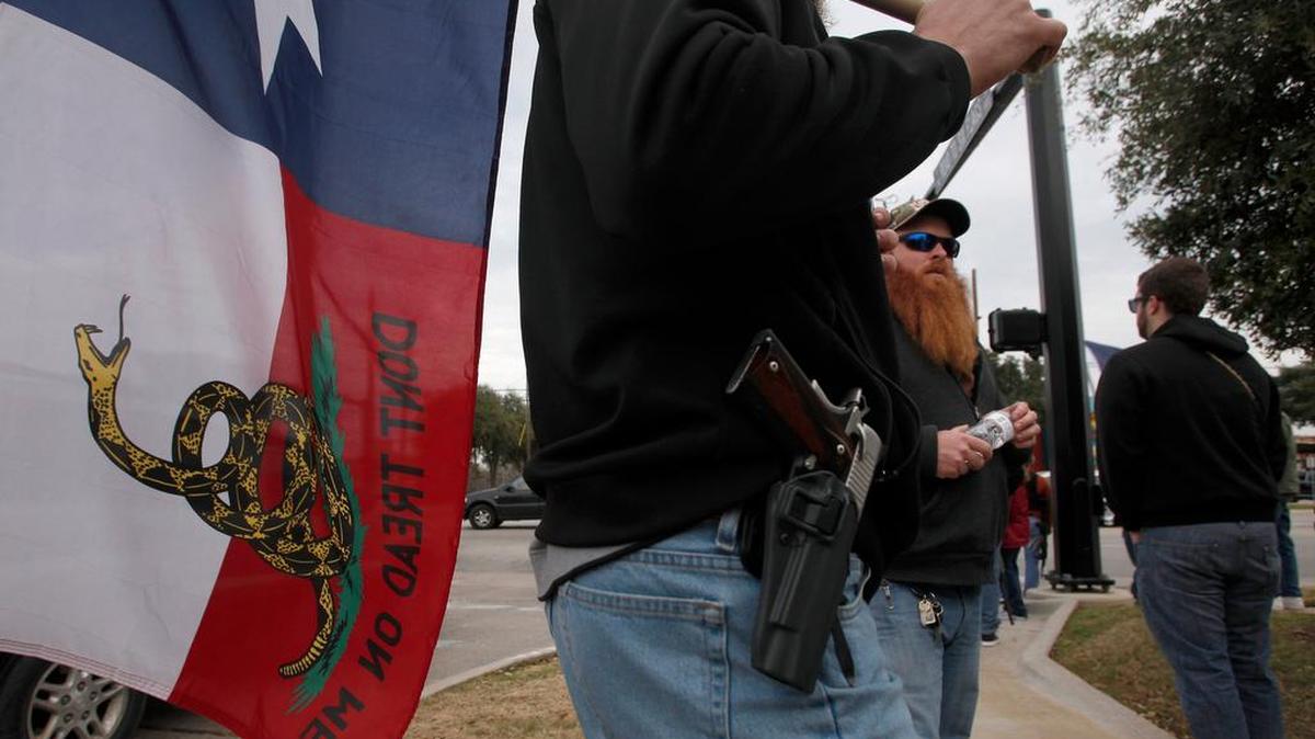 Activists gathered Friday for an open-carry walk along Road to Six Flags in Arlington.