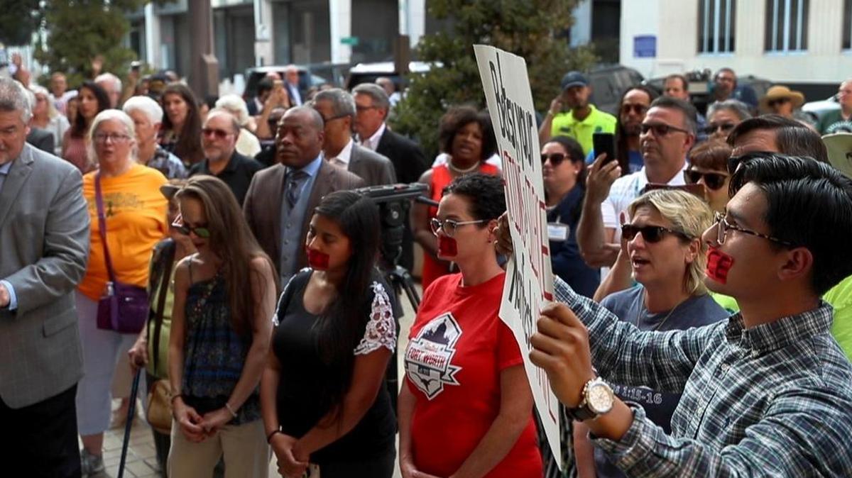 Residents gathered for a vigil for victims of recent mass shootings in El Paso and Dayton, Ohio on Aug. 6 outside Fort Worth City Hall.