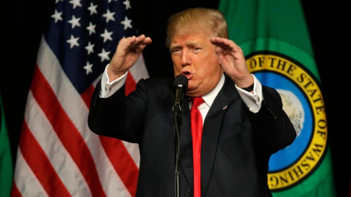 In this Republican presidential candidate Donald Trump speaks during a rally in Spokane, Wash. Trump is moving quickly to install political operatives in more than a dozen states, targeting Maine and Minnesota among others that traditionally favor Democrats, as the Republican White House contender lays the groundwork for an expanded electoral battlefield.