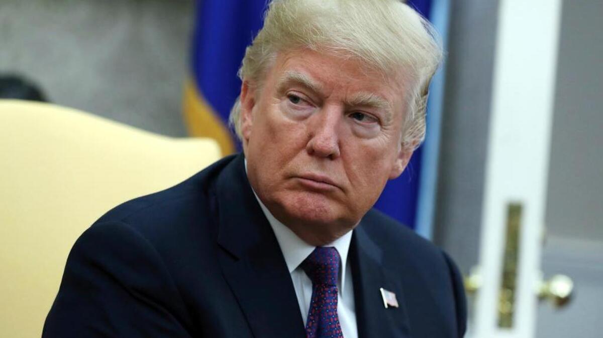 President Donald Trump listens during a meeting with Governor Ricardo Rossello of Puerto Rico in the Oval Office of the White House, Thursday, Oct. 19, 2017, in Washington.