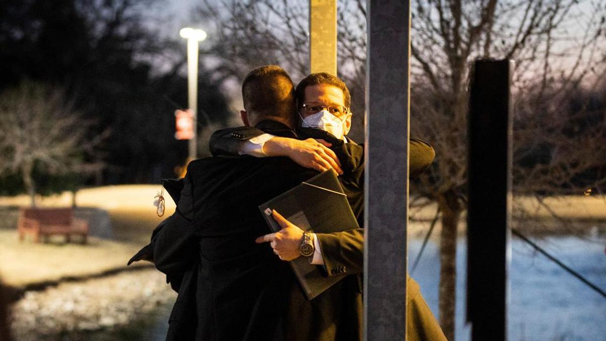 Congregation Beth Israel Rabbi Charlie Cytron-Walker (facing camera) hugs a man after a healing service Monday night, Jan. 17, 2022, at White’s Chapel United Methodist Church in Southlake. Cytron-Walker was one of four people held hostage by a gunman at his Colleyville, Texas, synagogue on Saturday.