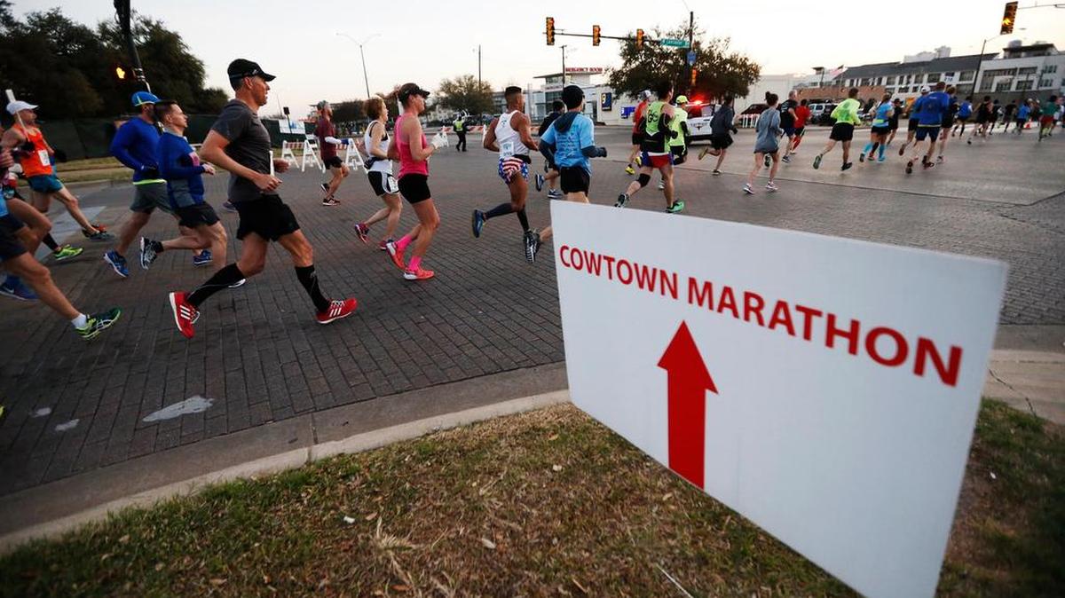 Cowtown half, full and ultra-marathon runners make their way down W Lancaster Ave. in Fort Worth, February 26, 2017.