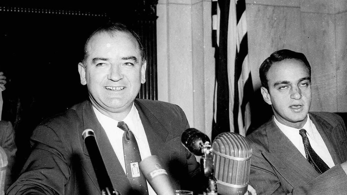 Sen. Joe McCarthy in a March 10, 1954 file photo. Seated at right is lawyer Roy Cohn.