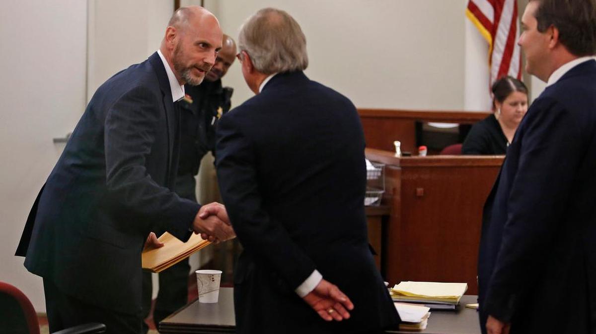 Brian Edward Franklin (left) shakes the hand of one of his attorneys, Dick DeGuerin (center) and Neal Davis (far right). A bond hearing was held in Judge Wayne Salvant's courtroom, Wednesday, May 4, 2016, for the release of Franklin, a former Fort Worth police officer convicted of sexual assault who was granted a new trial. He was in prison for 21 years before the appeals court reversed ruling and granted him a new trial.