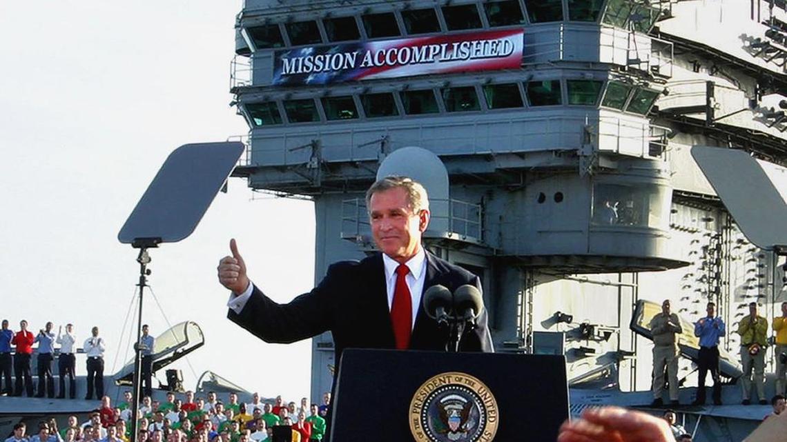 President Bush flashes a thumbs-up after declaring the end of major combat in Iraq aboard the aircraft carrier USS Abraham Lincoln off the California coast in this May 1, 2003 file photo.