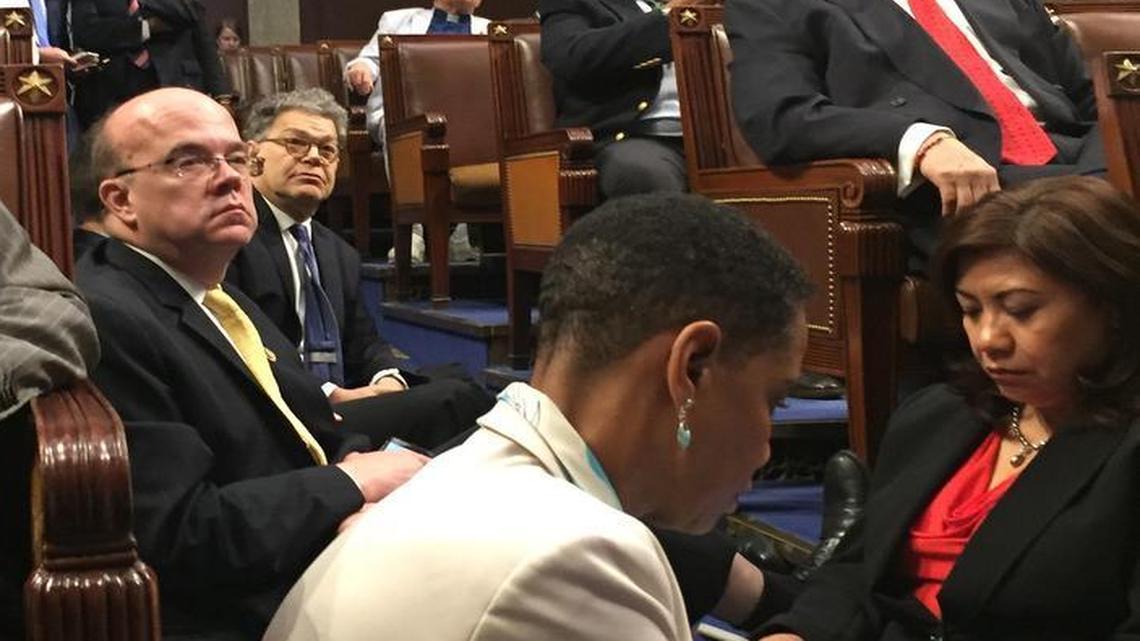 This photo provided by Rep.Suzanne Bonamici, D-Ore. shows Democrat members of Congress participating in sit-down protest seeking a a vote on gun control measures, Wednesday on the floor of the House on Capitol Hill in Washington.