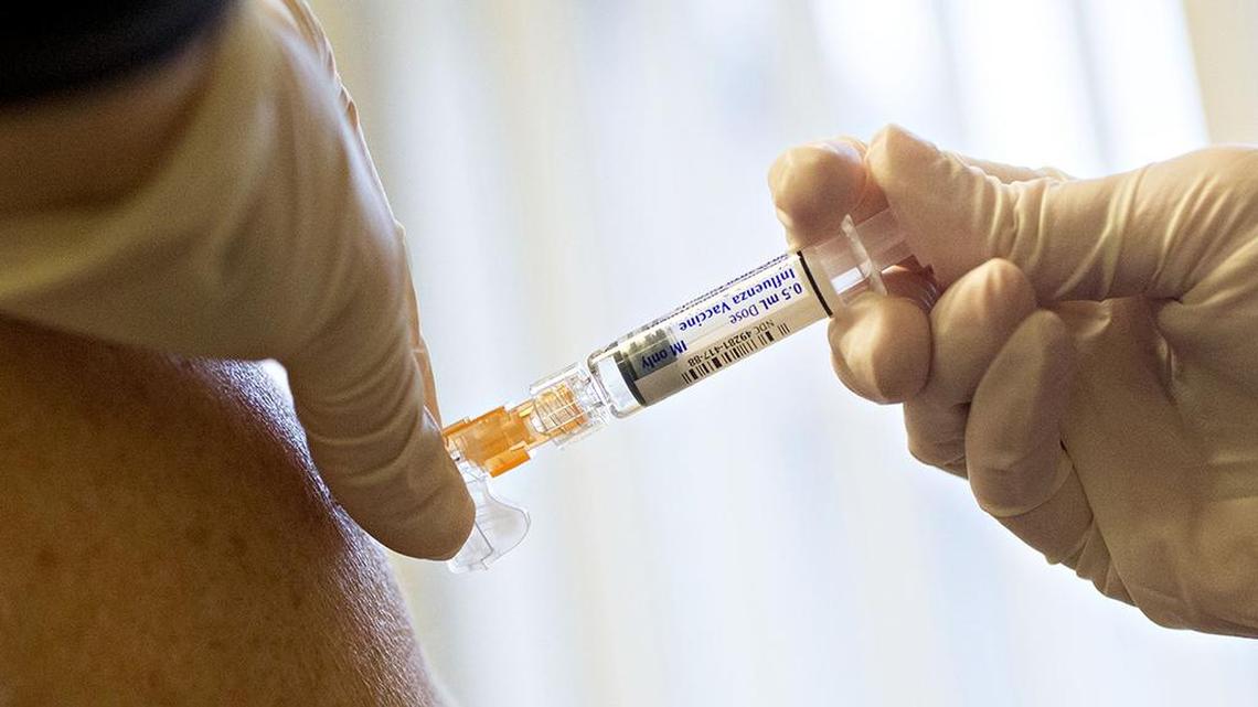 A nurse administers a flu shot at Perry Memorial Hospital in Princeton, Illinois, on Oct. 12, 2017. MUST CREDIT: Daniel Acker/Bloomberg