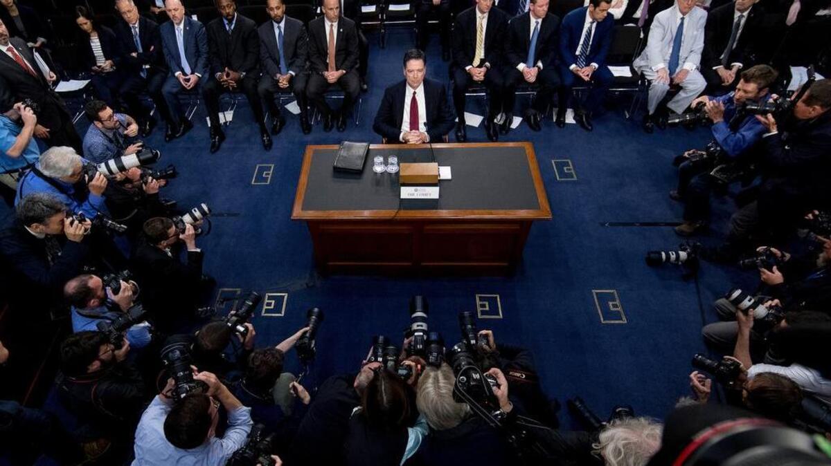 Former FBI Director James Comey arrives for a Senate Intelligence Committee hearing.