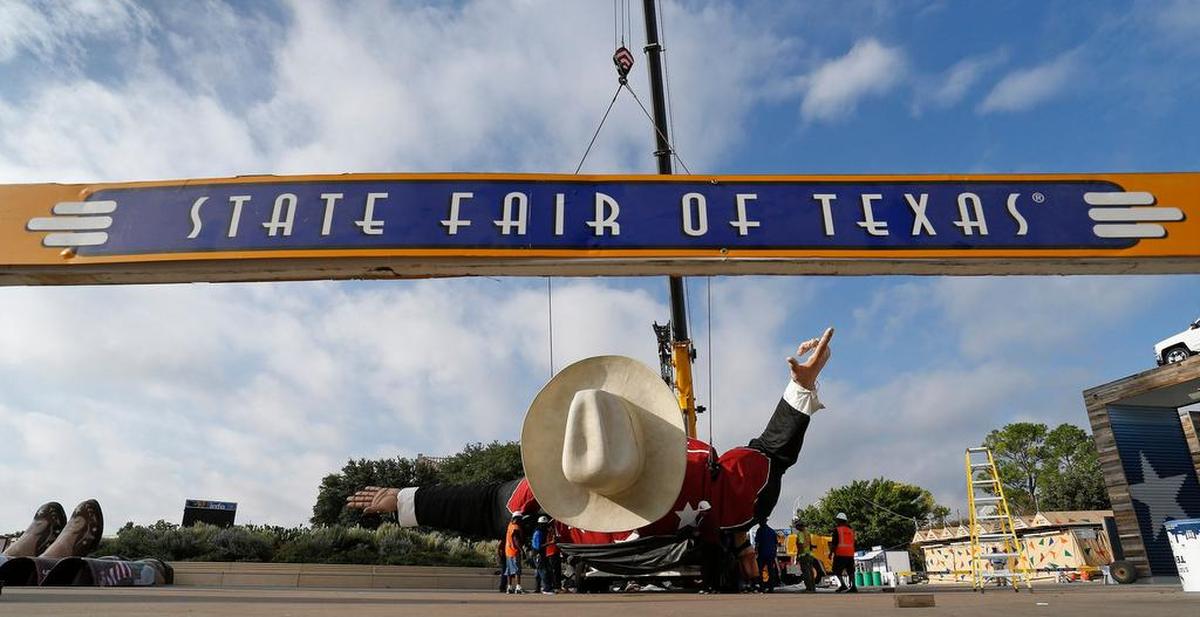 Big Tex lies on the ground ready to be hoisted up to a standing position.