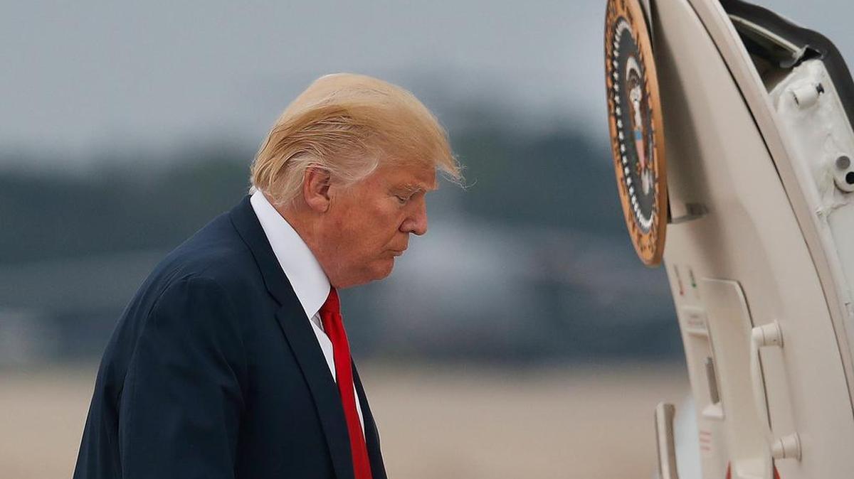 President Donald Trump boards Air Force One during his departure from Andrews Air Force Base, Md., Monday, Aug. 14, 2017.