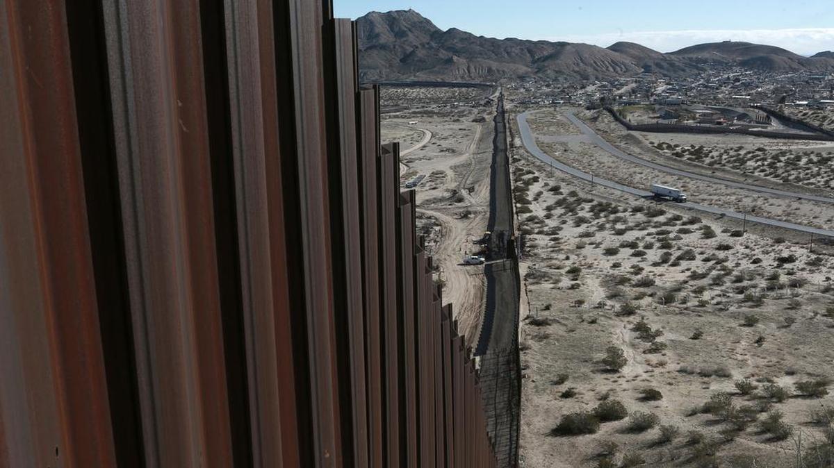 A truck drives near the Mexico-US border fence, on the Mexican side, separating the towns of Anapra, Mexico and Sunland Park, New Mexico.