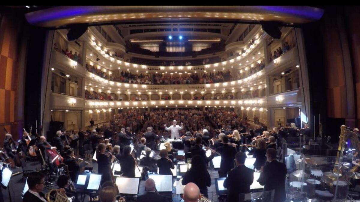 The Fort Worth Symphony Orchestra conducted by guest conductor Jack Everly plays the national anthem before the "Sci-Fi Spectacular" concert in Bass Hall on Friday, September 4, 2015.