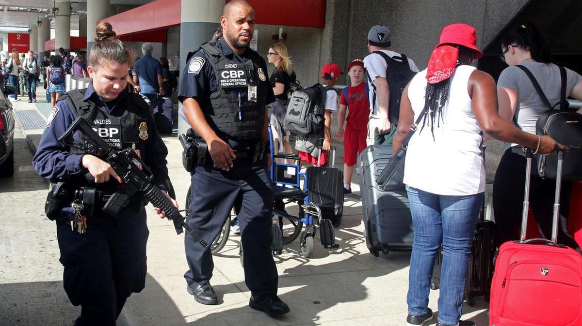 A heavy police presence was at the Ft. Lauderdale-Hollywood International Airport after it re-opened Saturday. Investigators continued their work downstairs in the baggage area of Terminal 2 the day after a shooting.