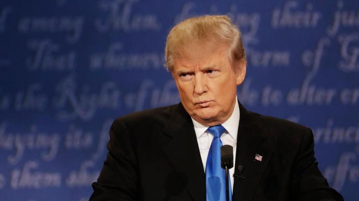 Republican presidential nominee Donald Trump listens to Democratic presidential nominee Hillary Clinton during the presidential debate at Hofstra University in Hempstead, N.Y., Monday, Sept. 26, 2016.
