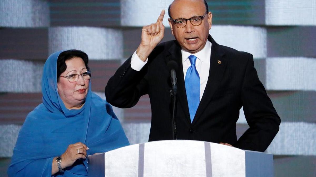 Khizr Khan, father of fallen US Army Capt. Humayun S. M. Khan speaks as his wife Ghazala listens during the final day of the Democratic National Convention in Philadelphia , Thursday, July 28, 2016.