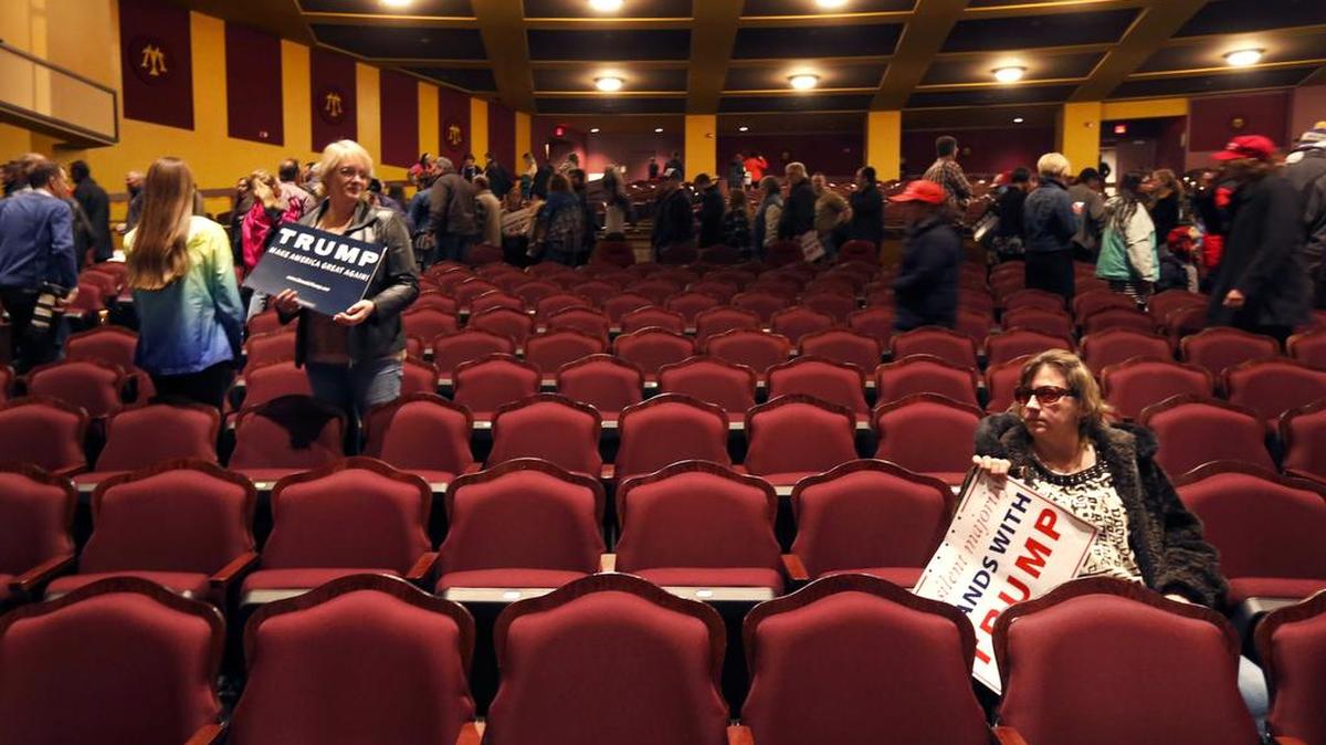 Supporters of Republican presidential candidate, Donald Trump sit after a rally at the Milwaukee Theatre Monday, April 4, 2016, in Milwaukee.
