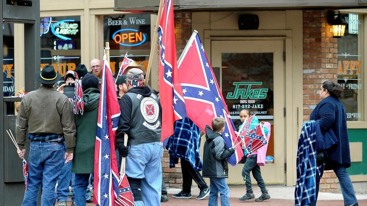 For the second year in a row, activists handed out Confederate flags at the 2017 All Western Parade in downtown Fort Worth, the kick-off event for the Fort Worth Stock Show.