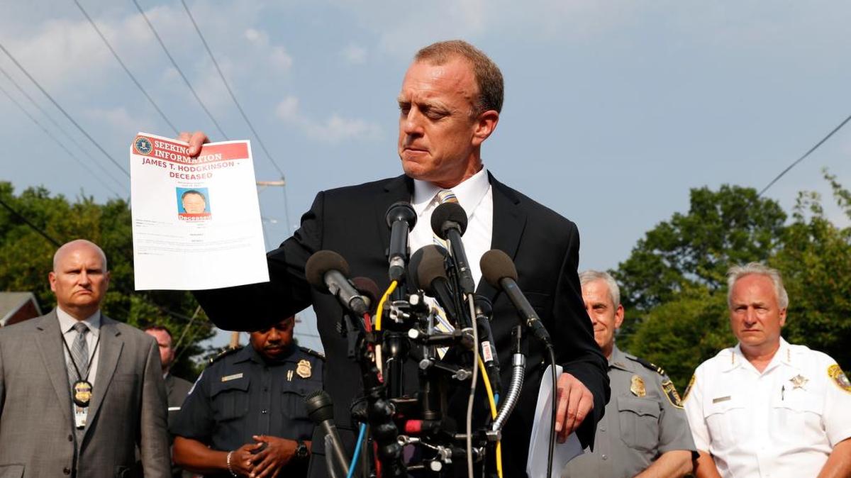 FBI Special Agent in Charge Tim Slater holds up a flyer looking for information about the deceased suspect James T. Hodgkinson, during a media availability Wednesday, June 14, 2017, in Alexandria, Va.