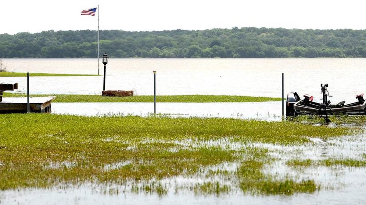 High water levels on Eagle Mountain Lake encroach on yards and driveways along Power Squadron Road in Azle, TX, Monday, June 22, 2015.