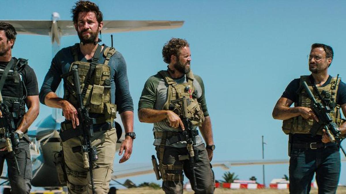 In this photo provided by Paramount Pictures shows Pablo Schreiber, from left, as Kris "Tanto" Paronto, John Krasinski as Jack Silva, David Denman as Dave "Boon" Benton and Dominic Fumusa as John "Tig" Tiegen, in the film, "13 Hours: The Secret Soldiers of Benghazi" from Paramount Pictures and 3 Arts Entertainment/Bay Films. The movie releases in U.S. theaters Jan. 15, 2016.