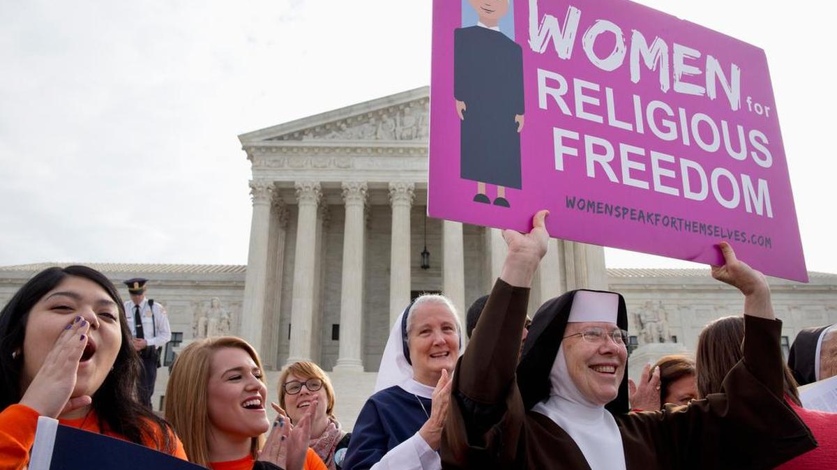 Nuns and supporters rally outside the Supreme Court in Washington on Wednesday.