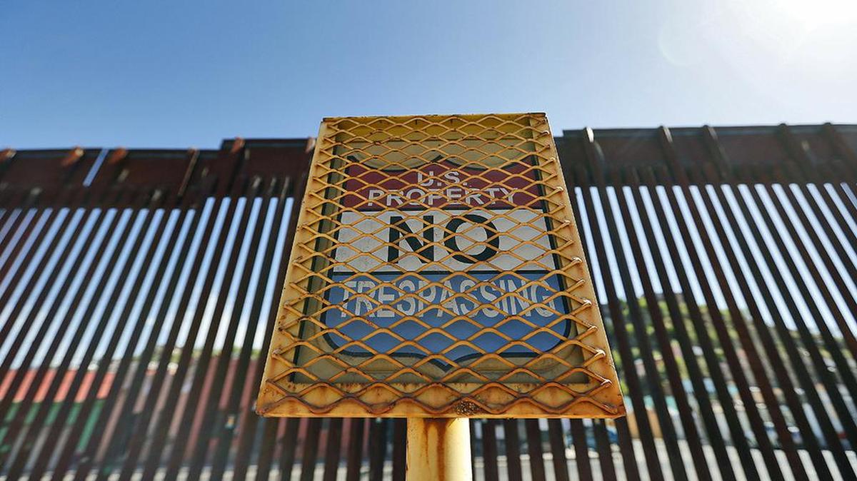 In this April 9, 2018, file photo, the international border between Mexico and the United States is seen from Nogales, Ariz.