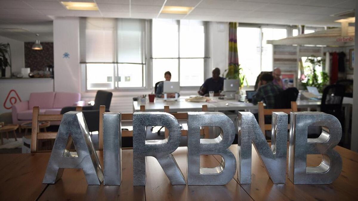 Employees of online lodging service Airbnb work in the Airbnb offices in Paris on April 21, 2015. AFP PHOTO / MARTIN BUREAU (Photo credit should read MARTIN BUREAU/AFP/Getty Images)