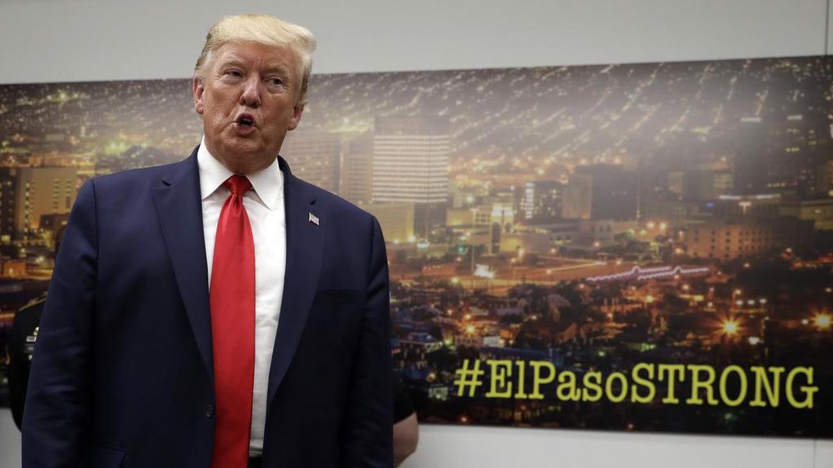 President Donald Trump speaks to the media as he visits the El Paso Regional Communications Center after meeting with people affected by the El Paso mass shooting on Aug. 7.