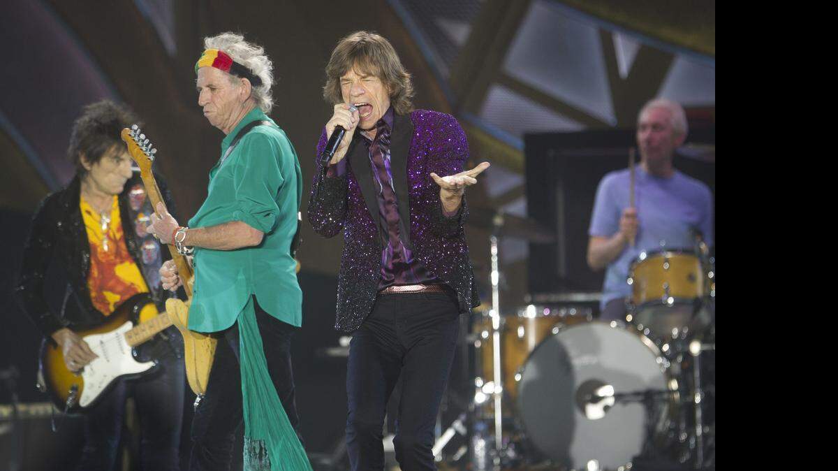 
Rolling Stones singer Mick Jagger performs with Keith Richards, second left, Ronnie Wood, left, and drummer Charlie Watts during a 2014 concert in Tel Aviv. 
