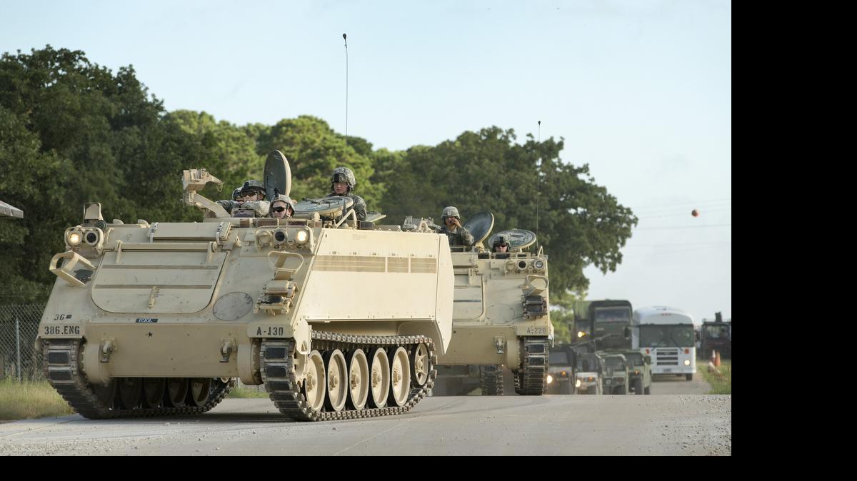 
National Guard troops move on Camp Swift,  near Bastrop, on Wednesday. . 
