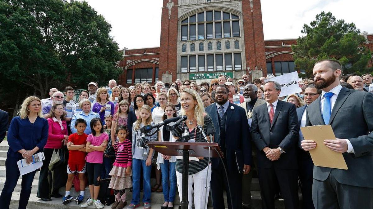 Alison Kelley speaks during a May 16 news conference to protest the Fort Worth school district’s bathroom use policies. Texas Attorney General Ken Paxton is second from right. Stand For Fort Worth, a organization of Fort Worth taxpayers and parents, held the press conference in front of Trimble Tech High School.