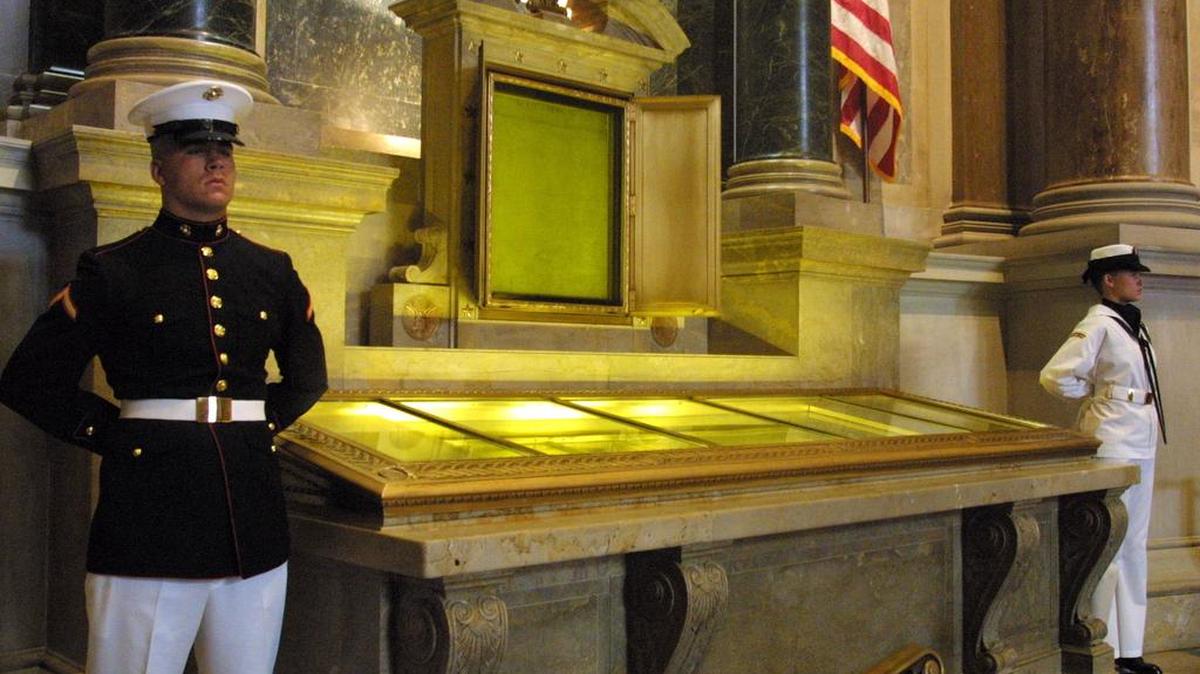 An honor guard stands next to the original copies of the Declaration of Independence, the Constitution and the Bill of Rights at the National Archives in Washington, D.C.