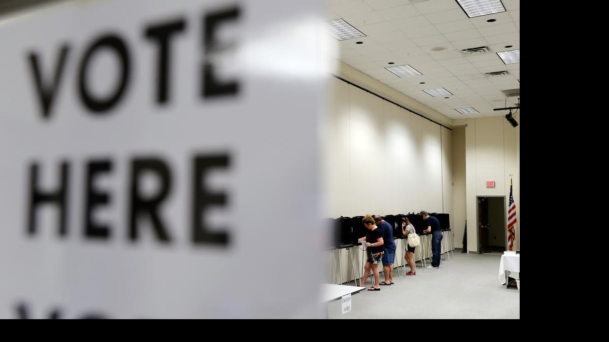 
Bedford voters mark their ballots at the Pat May Center last year. 
