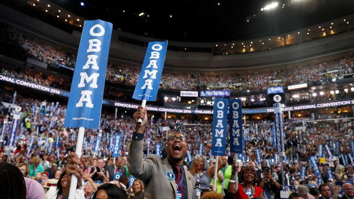 Delegates cheer as President Barack Obama takes the stage during the third day session of the Democratic National Convention in Philadelphia, Wednesday, July 27, 2016.